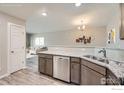 Well-lit kitchen featuring stainless steel appliances and granite countertops at 2435 Calais Dr # H, Longmont, CO 80504