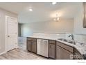 Well-lit kitchen featuring stainless steel appliances and granite countertops at 2435 Calais Dr # H, Longmont, CO 80504