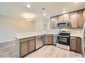 Bright kitchen with stainless steel appliances and modern countertops at 2435 Calais Dr # H, Longmont, CO 80504