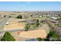Beautiful aerial view of horse property with pastures, homes, garages and outbuildings at 3380 County Road 38, Mead, CO 80542