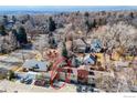 Aerial view of a residential neighborhood showing the subject property outlined in red at 409 Terry St # A, Longmont, CO 80501