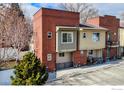 Brick and siding townhome shows a welcoming entrance and well-maintained facade at 409 Terry St # A, Longmont, CO 80501