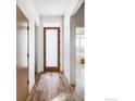 Bright hallway with wood-look floors and natural light at 751 W Grange Ct # A, Longmont, CO 80503