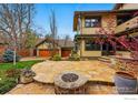 Amazing backyard with stone patio, fire pit, and detached garage at 851 14Th St, Boulder, CO 80302