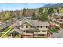 Aerial view of a home featuring a beautifully landscaped yard and mature trees at 851 14Th St, Boulder, CO 80302