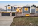 Charming two-story home with a three-car garage and landscaped front yard at 990 Utica Cir, Boulder, CO 80304