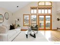 Bright living room with hardwood floors, large windows, and mountain views at 990 Utica Cir, Boulder, CO 80304