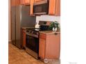 Kitchen with stainless steel range and refrigerator at 1465 Blue Sky Cir # 303, Erie, CO 80516