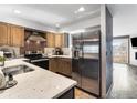 Well-equipped kitchen with stainless steel appliances, granite countertops and a functional layout at 1818 S Quebec Way # 3-1, Denver, CO 80231