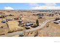 Aerial view of home on expansive lot, showcasing mature trees and surrounding properties at 200 Bothun Rd, Berthoud, CO 80513