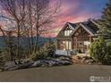 Beautiful log home features a large driveway and gorgeous mountain views at 2101 Bison Dr, Boulder, CO 80302