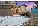 Charming two-story home with a two car garage, a brick facade, and a well-maintained lawn at 2166 Dailey St, Superior, CO 80027