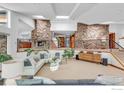 Spacious living room with stone columns, skylights, and modern staircase at 2796 Lee Hill Dr, Boulder, CO 80302