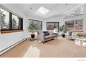 Sun-filled living room features multiple windows with scenic views at 2796 Lee Hill Dr, Boulder, CO 80302