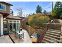 Beautiful backyard featuring a stone patio with outdoor dining set and built-in grill at 2925 4Th St, Boulder, CO 80304