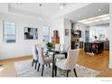 Elegant dining room with natural light, modern table setting, and hardwood floors at 2925 4Th St, Boulder, CO 80304