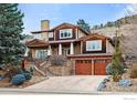 Charming multi-story home with stone accents, a two-car garage, and professionally landscaped front yard at 2925 4Th St, Boulder, CO 80304