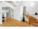 Bright foyer featuring wood floors, a grand staircase, and an open floor plan at 2925 4Th St, Boulder, CO 80304