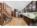 Spacious kitchen with dark wood cabinetry, stainless steel appliances, and a light-filled breakfast nook at 3323 Hickok Pl, Boulder, CO 80301