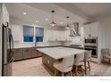 Bright, contemporary kitchen featuring a large center island, two-tone cabinetry, and stainless steel appliances at 375 Marshall Rd, Superior, CO 80027