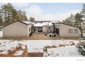 The backyard features a stone patio with outdoor seating, perfect for entertaining guests at 412 Wild Horse Cir, Boulder, CO 80304