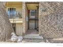 An exterior view of a brick townhome showing a walkway and the unit number at 4639 S Lowell Blvd, Denver, CO 80236