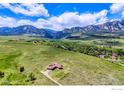 Wide open aerial shot of house surrounded by a lot of land and greenery at 4702 Eldorado Springs Dr, Boulder, CO 80303