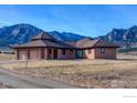 Lovely single-story home showcasing a three-car garage and mature landscaping at 4702 Eldorado Springs Dr, Boulder, CO 80303