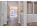 Bright entryway with decorative niche and wood-look flooring at 5126 Mt Buchanan Ave, Frederick, CO 80504