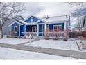 Blue home featuring a welcoming front porch, perfect for enjoying a cup of coffee at 5126 Mt Buchanan Ave, Frederick, CO 80504