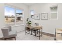 Bright home office with large windows, neutral decor, and a contemporary desk at 735 Discovery Pkwy, Superior, CO 80027