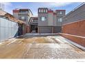 Exterior image highlighting the modern architecture with the garage, design of these townhomes and parking area at 856 Walnut St # A, Boulder, CO 80302