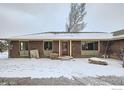 Charming single-story brick home featuring well-maintained landscaping and a welcoming red front door at 10075 N 75Th St, Longmont, CO 80503