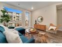 Bright living room with a large window, stylish furniture, and a cozy atmosphere at 20 Wilcox St # 519, Castle Rock, CO 80104