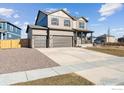 Well-maintained two-story home with three-car garage and landscaped front yard at 4107 Marble Dr, Mead, CO 80504