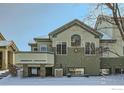 Rear exterior view featuring a balcony and multiple windows under a clear blue sky at 4143 Da Vinci Dr, Longmont, CO 80503