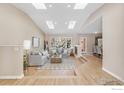 Inviting living room with hardwood floors, lots of natural light, and open layout to the dining area at 4760 Mckinley Dr, Boulder, CO 80303