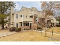 Inviting townhouse showcasing well-maintained landscaping, a mix of siding and brick, and a welcoming entrance at 5001 Garrison St # 6, Wheat Ridge, CO 80033