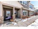 Inviting exterior showcasing a covered front porch and stylish design elements, a perfect place to relax at 891 Winding Brook Dr, Berthoud, CO 80513