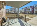 Spacious covered patio showcases neighborhood views and seating area at 11225 Colony Cir, Broomfield, CO 80021