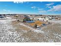 Aerial view of a well-maintained fenced in yard on a open lot in a beautiful community at 16504 N Fairbanks N Rd, Platteville, CO 80651