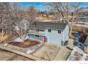 Charming two-story home with a well-maintained front yard and a spacious two-car garage at 1714 Zeus Dr, Lafayette, CO 80026