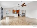 Spacious living room with hardwood floors, fan, and an open layout, creating a welcoming and airy atmosphere at 195 S Cleveland Ave, Louisville, CO 80027