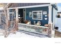 Inviting front porch with cozy seating, perfect for enjoying the outdoors and neighborhood views at 2112 Cadman St, Berthoud, CO 80513