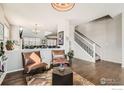 Bright and airy living room featuring hardwood floors and an open layout at 2289 French Cir, Longmont, CO 80504