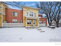 Inviting townhome showcases unique architecture, a snow covered front yard and a cozy, neighborhood setting at 3380 Folsom St # 115, Boulder, CO 80304