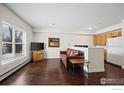 Bright living area featuring hardwood floors, a large window and an open floorplan at 3380 Folsom St # 115, Boulder, CO 80304