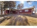 Charming single story home with a brick foundation, mature trees, and well maintained lawn at 3401 Meining Rd, Berthoud, CO 80513