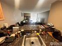 The kitchen overlooks the living area. It features modern finishes and ample counter space at 805 29Th St # 204, Boulder, CO 80303