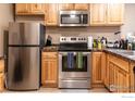 Clean kitchen featuring stainless steel appliances and light wooden cabinetry at 805 29Th St # 204, Boulder, CO 80303